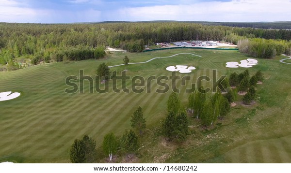 Top view green golf course outdoor green\
grass field. Aerial view from flying\
drone