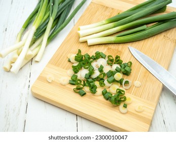 top view of green onion cut on a cutting board - Powered by Shutterstock