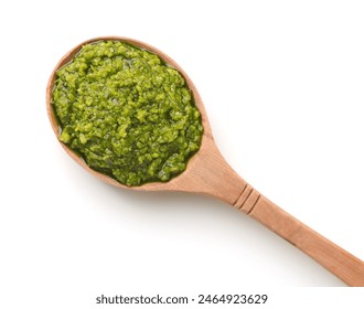 Top view of green pesto sauce in wooden spoon isolated on white - Powered by Shutterstock