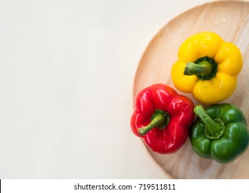 Top view of green, yellow and red bell pepper with copy space.