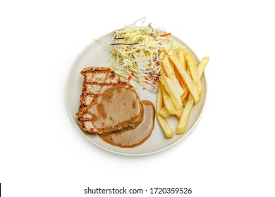 Top View Grill Pork Steak With Creamy Pepper Sauce, Served With Vegetable Salads And French Fries On White Background