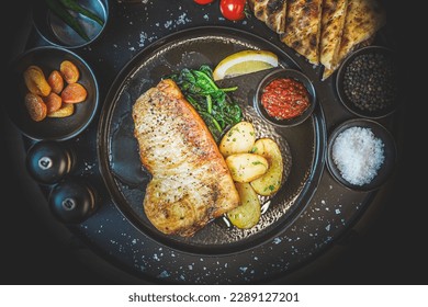 Top View of Grilled Boneless Turbot Fillet: Delicate White Fish, Steamed Spinach, Roasted New Potatoes, Healthy Gourmet Meal, Tasty Culinary Experience, Balanced Flavors, Appetizing Presentation