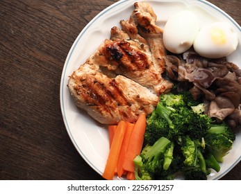 top view grilled chicken breast with boiled egg, carrot, broccoli and broccoli - Shutterstock ID 2256791257