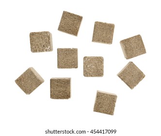 Top View Of A Group Of Beef Flavored Bouillon Cubes Isolated On A White Background.