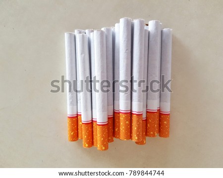 Top view group of cigarettes, pack of cigarette on white background, weed, baccy or tobacco smoking death and danger concept, the cigarettes made cancers.