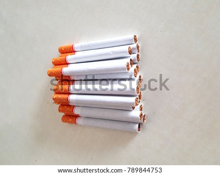 Top view group of cigarettes, pack of cigarette on white background, weed, baccy or tobacco smoking death and danger concept, the cigarettes made cancers.