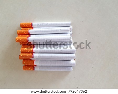 Top view group of cigarettes, pack of cigarette on white background, weed, baccy or tobacco smoking death and danger concept, the cigarettes made cancers.
