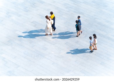 Top View Of Group Family Mothers And Kids Walking At Pedestrian Walkway Outdoor For Traveling Or Exercise Healthy. Crowd People At Background Landscape Public Street In City. Girl And Boys Are Funny. 