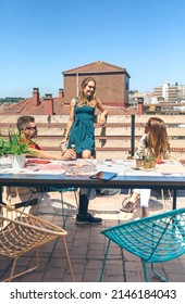 Top View Of Group Of Friends Talking And Drinking At A Party On A Terrace