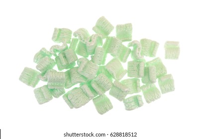 Top View Of A Group Of Green Polystyrene Packing Peanuts Isolated On A White Background.