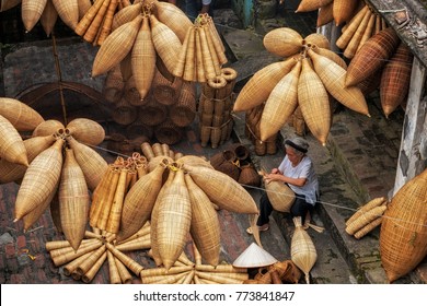 Top view of Group of Old Vietnamese female craftsman making the traditional bamboo fish trap or weave at the old traditional house in Thu sy trade village, Hung Yen,Vietnam, traditional artist concept