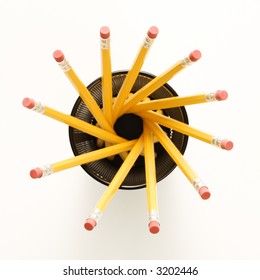 Top View Of Group Of Pencils In Pencil Holder Arranged In A Spiral Shape.