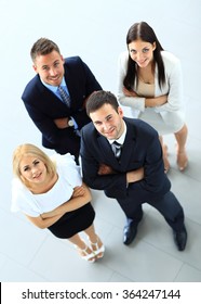 Top View Of Group Of People. Four People Looking Up