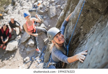 Top View Of Group Of Seniors With Instructor Climbing Rocks Outdoors In Nature, Active Lifestyle.