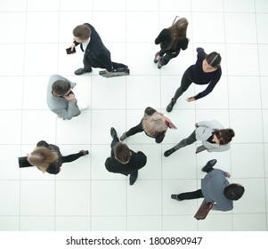 Top View. Group Of Serious Diverse Business People Looking At The Camera