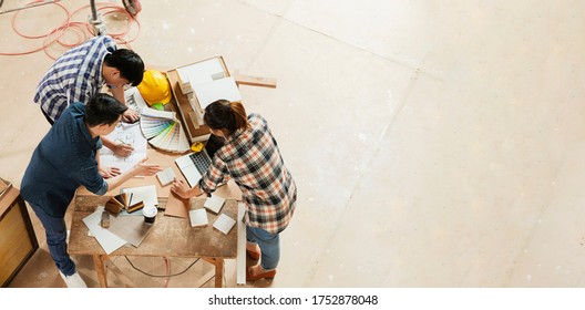 Top View Of Group Of Smart Asian Architect Interior Design Team Consulting With Constrction Engineer Work Brainstrom  Meeting With House Project Blueprint And Home Mockup In House Renovation Structure