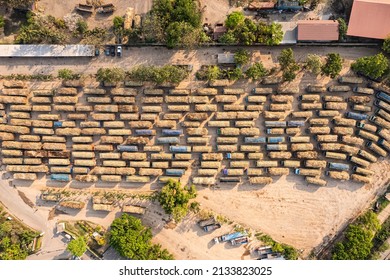 Top View Of Group Of Sugarcane Harvested Truck Parked Queue To Send The Agricultural Produce In Industry Processing Plant Area