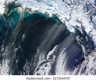 Top View Of Gulf Of Alaska, Copper River Delta, Glaciers. Dust Storm Off Alaska, Dust Plumes Blowing Off The Coast. Aerial View HD Background. Elements Of This Image Furnished By NASA. Selective Focus