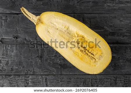 Top View of Halved Spaghetti Squash on Rustic Wooden Background
