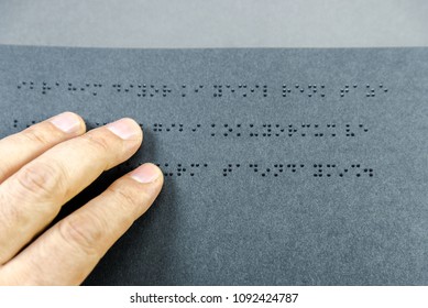 Top view of hand of a blind person reading a book written in braille alphabet for blind people. Istanbul,Turkey.10 February 2017