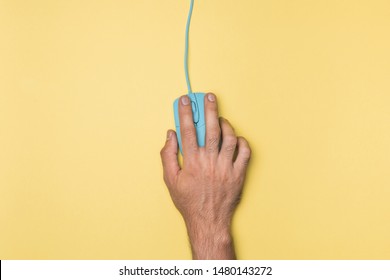 Top View Hand Holding Computer Mouse