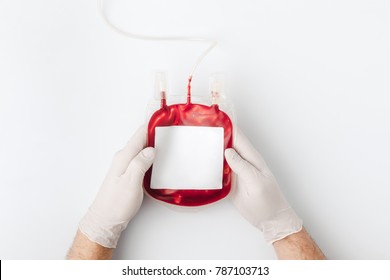 top view of hands in gloves holding blood for transfusion isolated on white background   