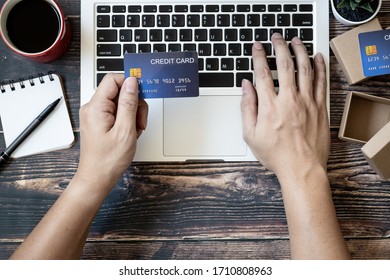 Top view hands holding credit cards for online shopping - Shutterstock ID 1710808963