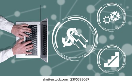 Top view of hands using laptop with symbol of economic collapse concept - Shutterstock ID 2395383069