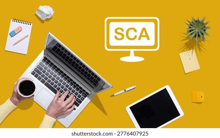 Top view of hands using laptop with symbol of sca concept