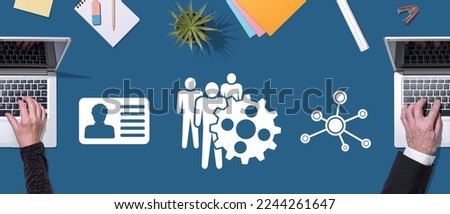 Top view of hands using laptop with symbol of hrm concept