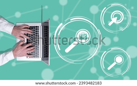 Top view of hands using laptop with symbol of job search concept