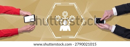Top view of hands using mobile phone with symbol of competence concept