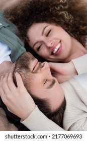 Top View Of Happy Blurred Woman Touching Face Of Blurred Man