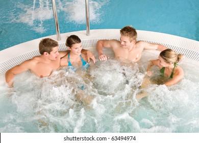 Top View  - Happy Young People Relax In Hot Tub