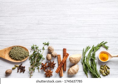 Top view healthy food immune boosting properties with herbs, spices, plant, nuts white background copy space.
