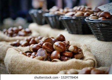Top view heap of chestnuts. Pile of ripe chestnuts for food background.
