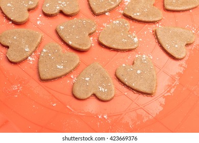 Top View Of Heart Shaped Raw Dough Prepared For Cookies