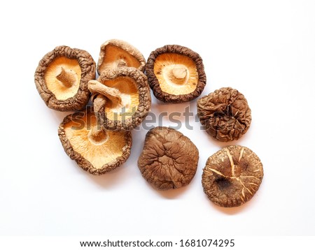 Top view of herbs and spices with dried shiitake mushrooms isolated on white background.