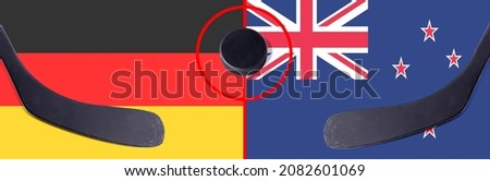 Top view hockey puck with Germany vs. New Zealand command with the sticks on the flag. Concept hockey competitions
