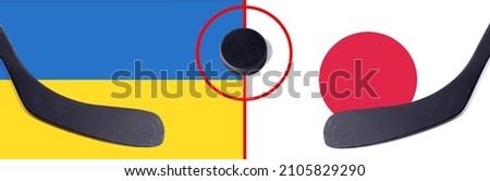 Top view hockey puck with Ukraine vs. Japan command with the sticks on the flag. Concept hockey competitions