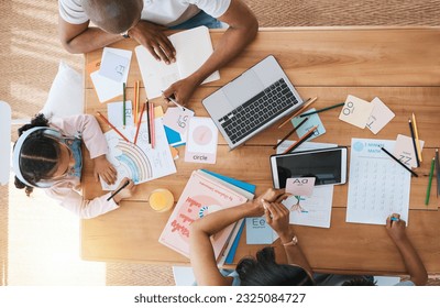 Top view, home and girl with parents, homework and learning with support, care and bonding at desk. Father, mother and daughter with drawing, education and teaching with technology in family house - Powered by Shutterstock