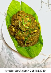 Top View Of Homemade Chicken Rendang On White Plate With White Marble Background. Chicken Rendang Is A Famous Dish In Malaysia And Indonesia. Made Of Chicken Stew With Coconut Milk And Some Spices.