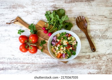 Top View Of Homemade Pasta Salad And Fresh Ingredients On A White Wood Background