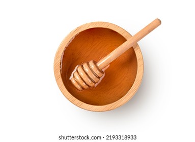 Top view Honey in wooden bowl with dipper isolated on white background.