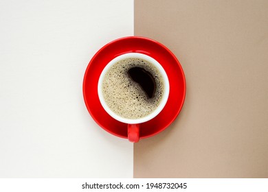 Top View Of Hot Coffee Cup In Red Ceramic Mug With Red Ceramic Plate Placed On The Centre During Brown And Cream Colour Paper, Copy Space.