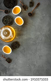 Top view of hot and dry tea in teapot and cups. Tea ceremony concept