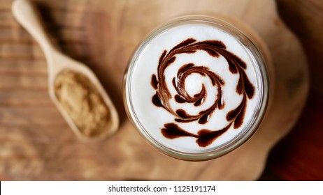 Top View Of Hot Mocha Coffee Latte Art Chocolate Heart Shape Spiral Glass On Table Background, Vintage Style