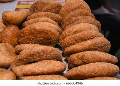 Top View Of Hot And Spicy Onion Or Pyaaz Kachori And Rajasthani Mirchi Bada / Jodhpuri Mirchi Vada Indian Street Food Snack Jaipur, Rajasthan India. Traditional Deep Fried Fast Food Item In Gram Flour