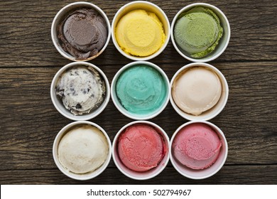 Top View Ice Cream Flavors In Cup On Blackground