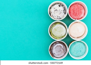 Top View Ice Cream Flavors In Cup On Green Background